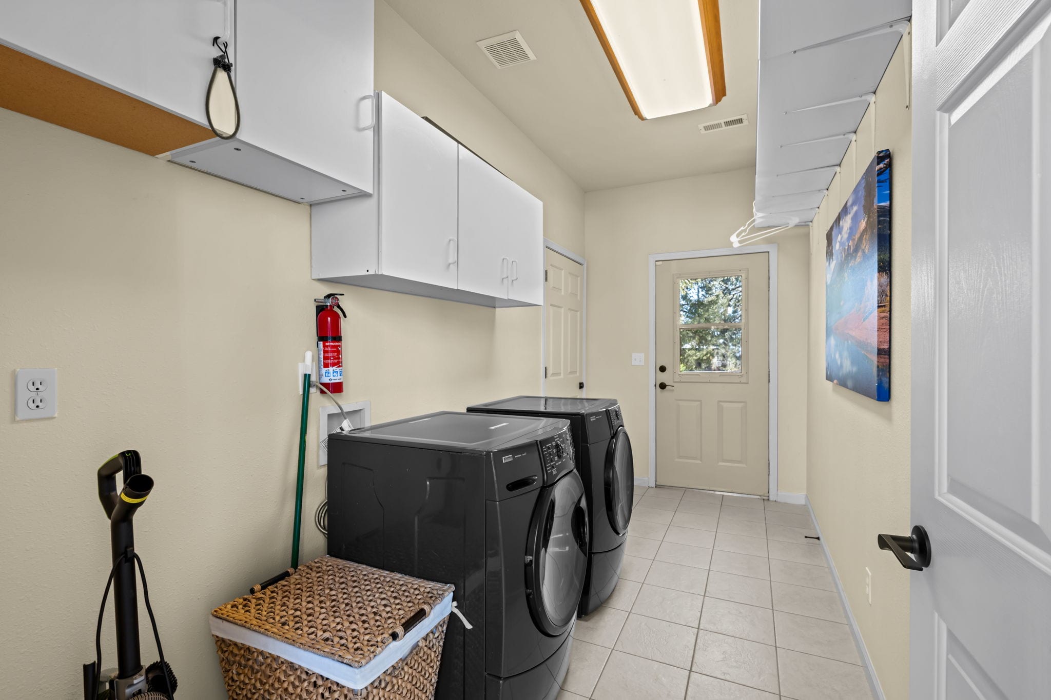 Laundry room with front-loading washer and dryer