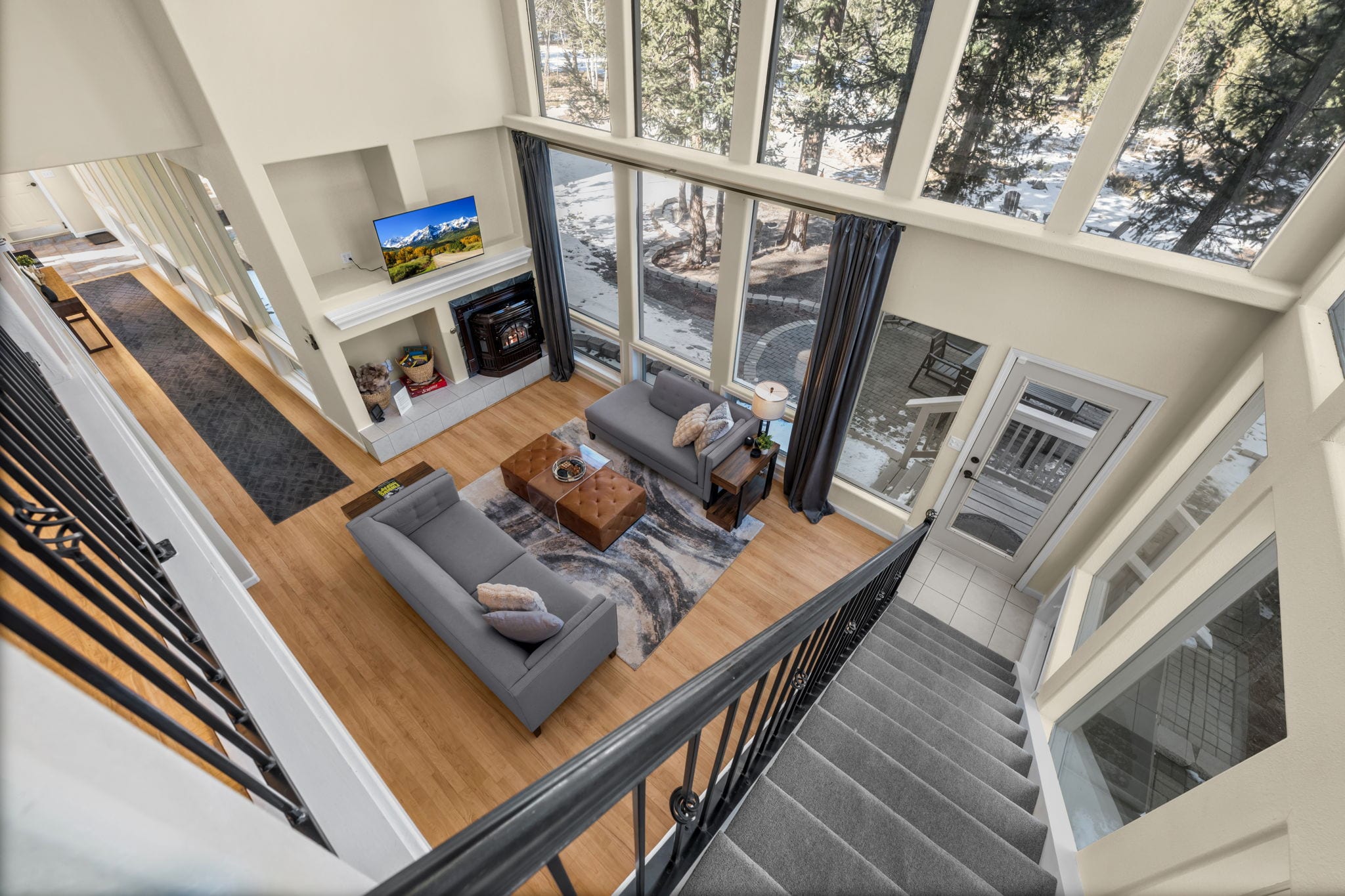 Comfortable living room seating arranged around the fireplace